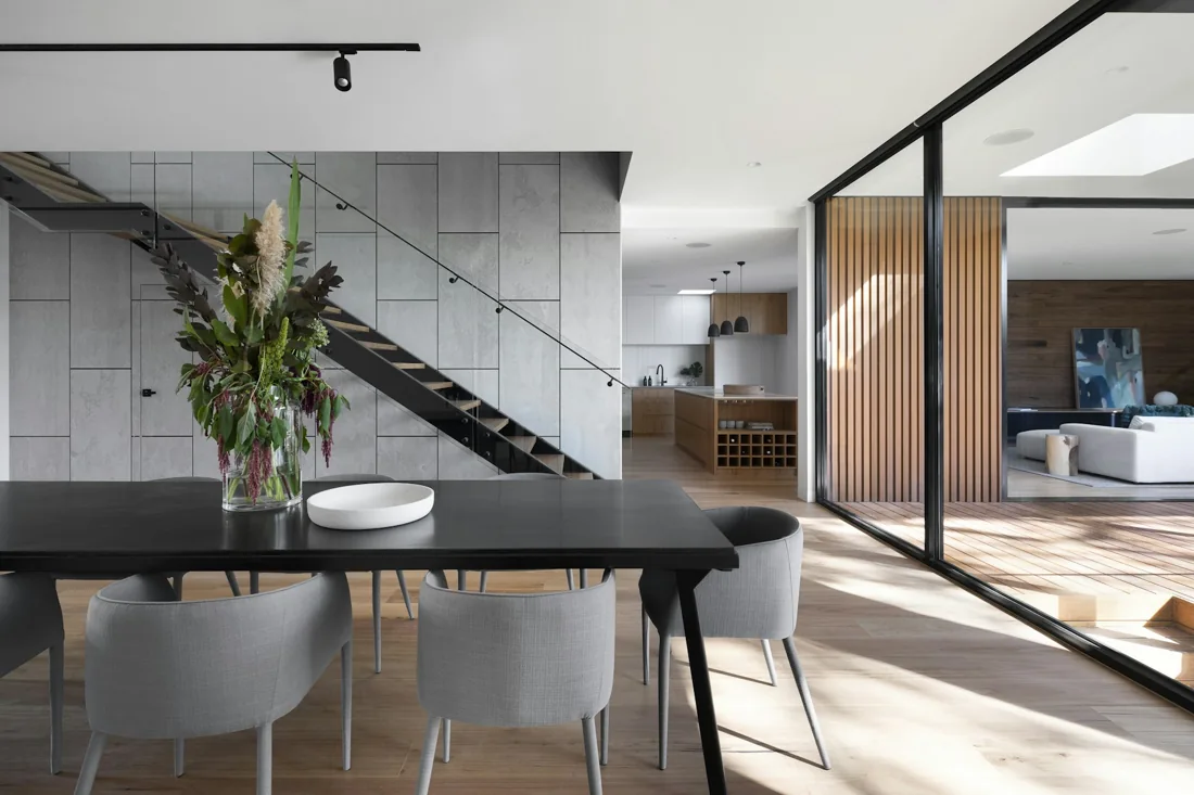 Open living space with a warm neutral palette and considered lighting