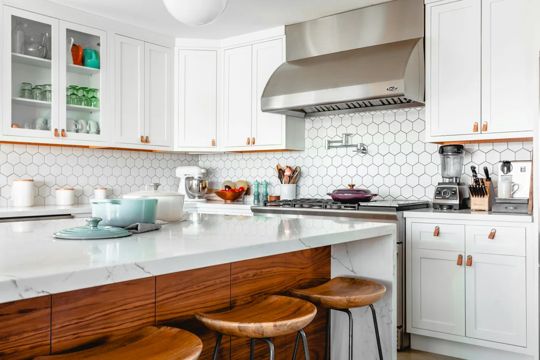 Bright contemporary kitchen with cabinetry and an island